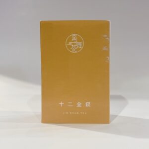 十二金釵金萱茶包裝與金黃色茶湯，帶有天然奶香